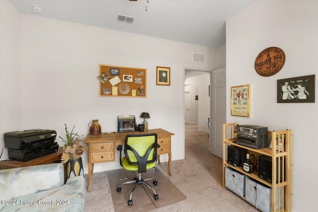 office area featuring light colored carpet and ceiling fan