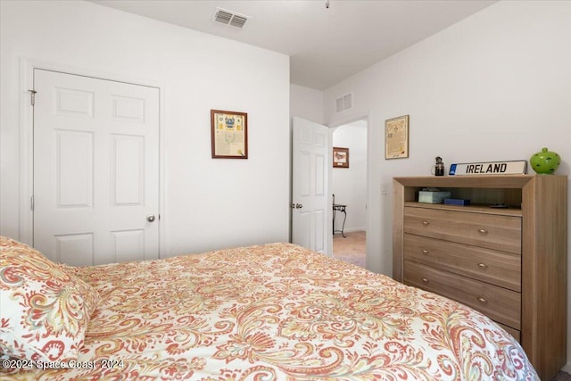 carpeted bedroom with a closet