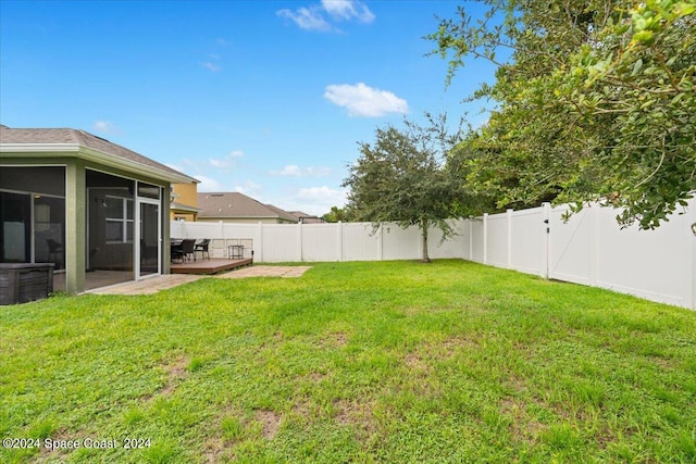 view of yard with a patio and a sunroom