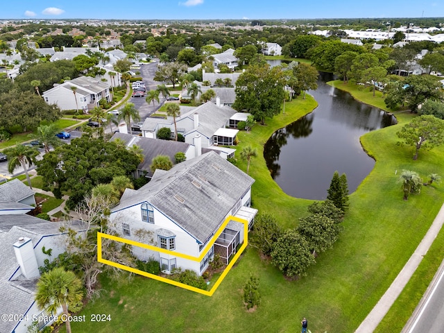 birds eye view of property with a water view