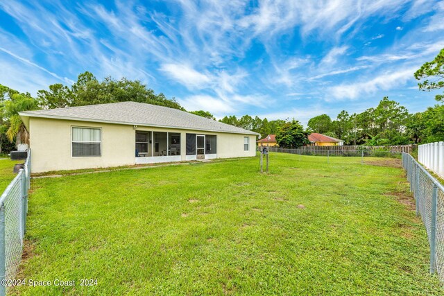 view of yard with a sunroom