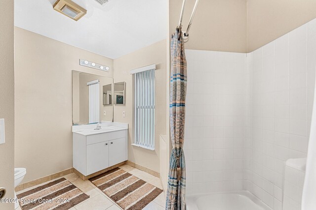 full bathroom featuring vanity, toilet, shower / tub combo, and tile patterned floors