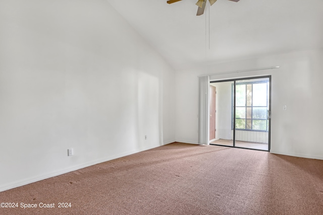 carpeted spare room with high vaulted ceiling and ceiling fan