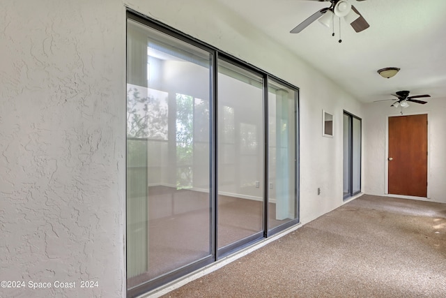 interior space with a wealth of natural light and ceiling fan