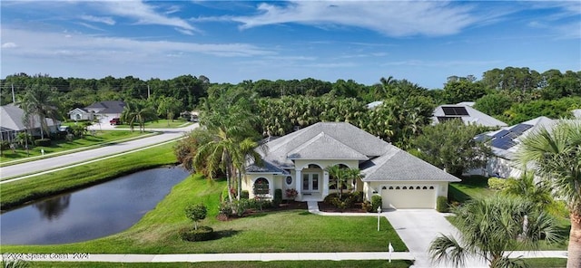 view of front of house featuring a garage and a front yard