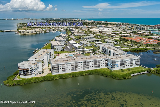 birds eye view of property featuring a water view