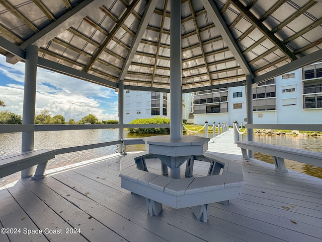 dock area with a deck with water view