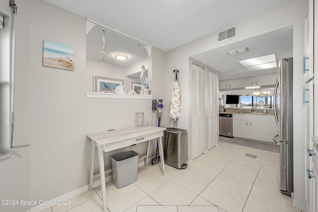 interior space featuring a textured ceiling and sink