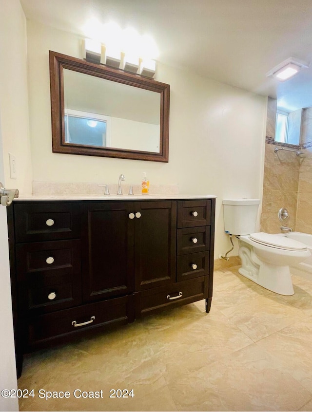 bathroom with vanity, toilet, and tile walls