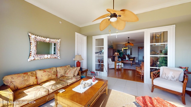 living room with ornamental molding, ceiling fan, and light hardwood / wood-style floors