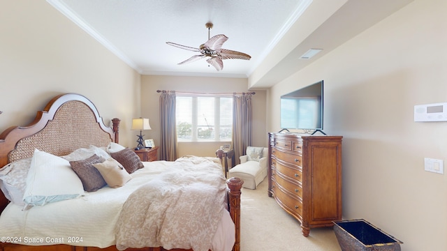 bedroom featuring crown molding, light colored carpet, and ceiling fan