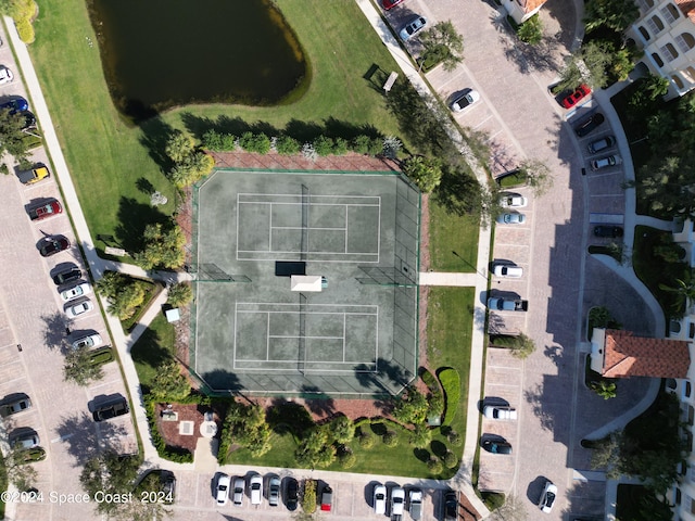 birds eye view of property with a water view