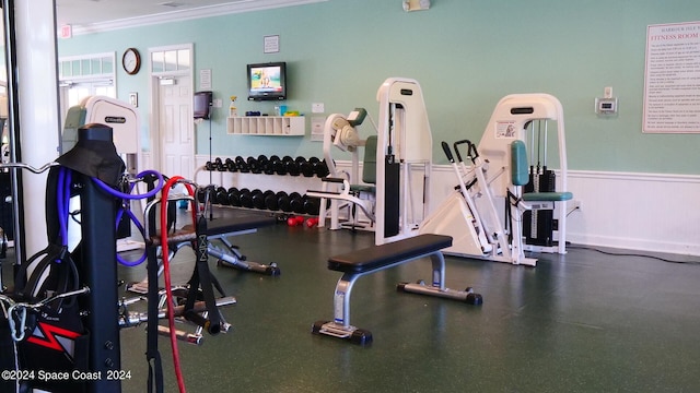 exercise room featuring ornamental molding