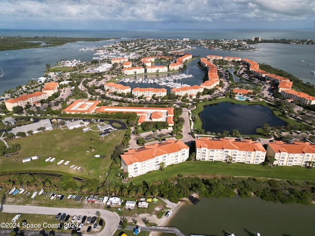 birds eye view of property featuring a water view