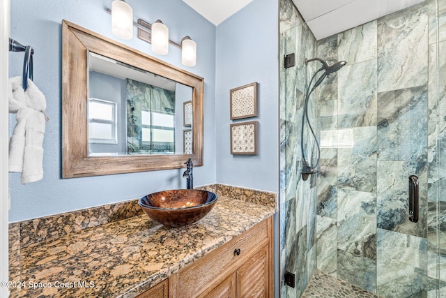 bathroom with vanity and walk in shower