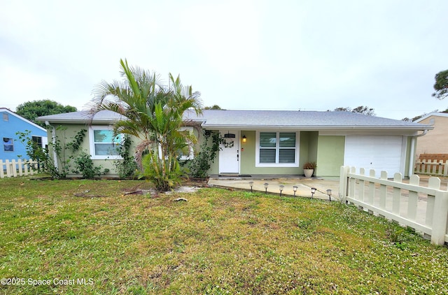 single story home featuring an attached garage, fence, a front lawn, and stucco siding