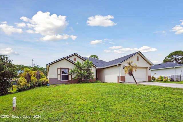 ranch-style house with a garage and a front lawn