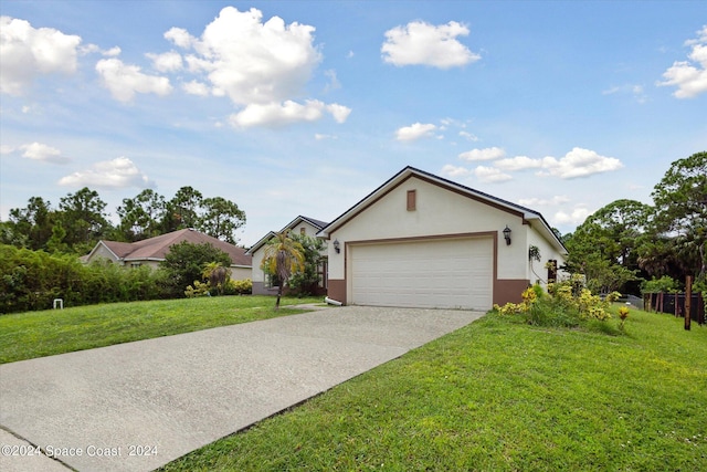 ranch-style house featuring a front yard and a garage