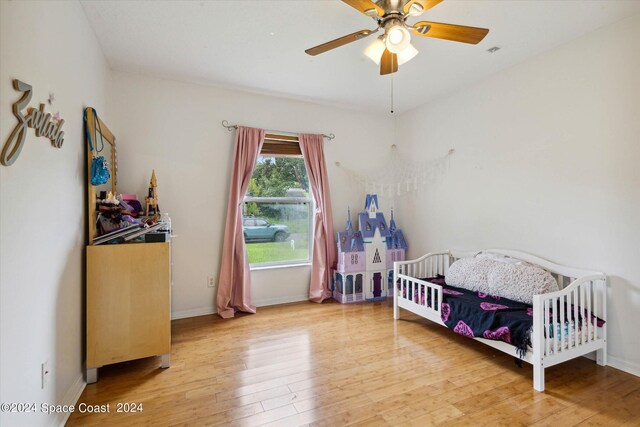 bedroom featuring light wood-type flooring and ceiling fan