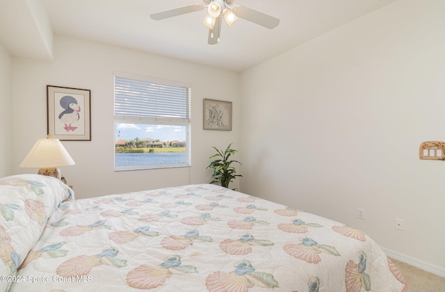 bedroom featuring ceiling fan and carpet floors