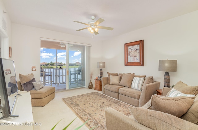 carpeted living room featuring ceiling fan