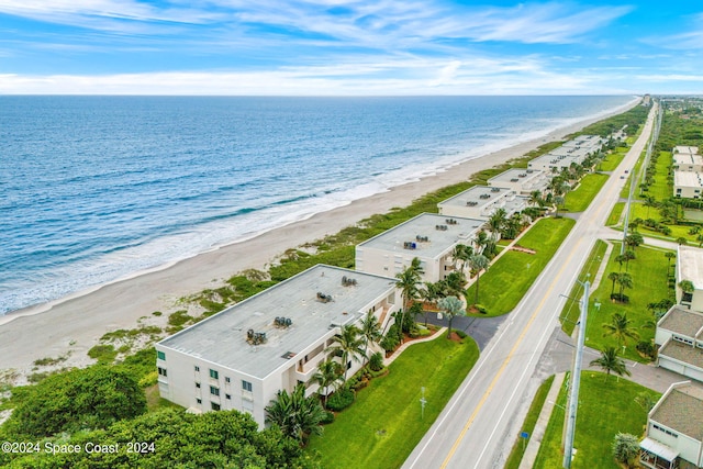 aerial view featuring a water view and a view of the beach