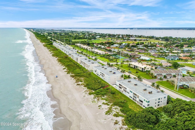 bird's eye view with a beach view and a water view