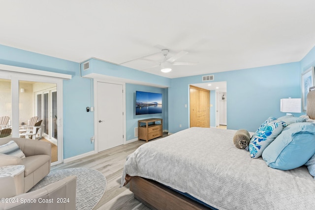 bedroom with ceiling fan, a closet, and light wood-type flooring