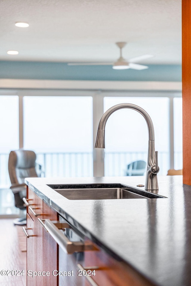 interior space with sink and ceiling fan