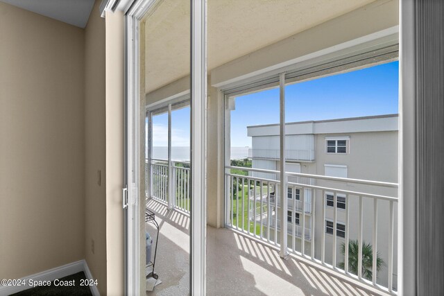 balcony featuring a water view