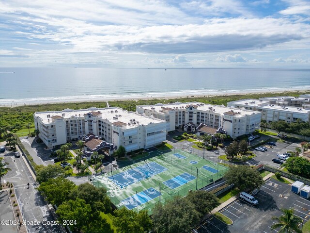 bird's eye view with a beach view and a water view