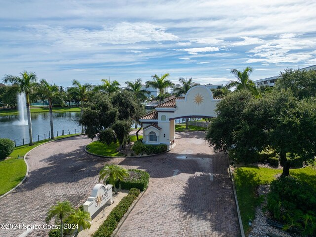 mediterranean / spanish house featuring a water view