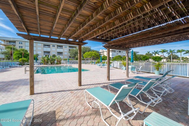 view of swimming pool with a patio area