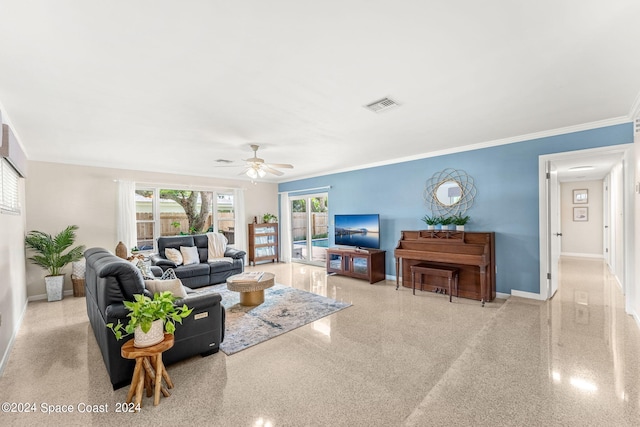 living room featuring ceiling fan and crown molding