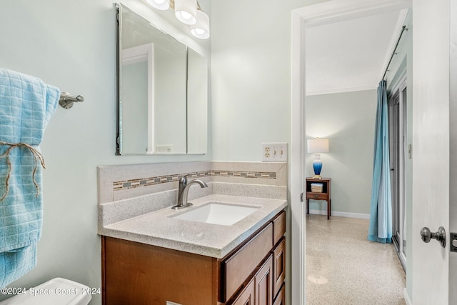 bathroom with toilet and vanity