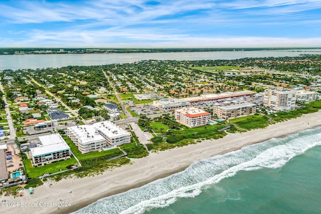 bird's eye view with a view of the beach and a water view