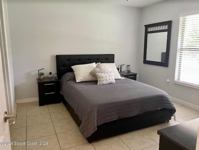 bedroom featuring light tile patterned floors