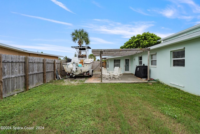 view of yard with a patio and a pergola