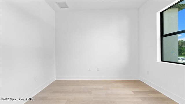 566 Hamy St, Palm Bay, FL 32908 - unfurnished room with light wood-style floors and baseboards