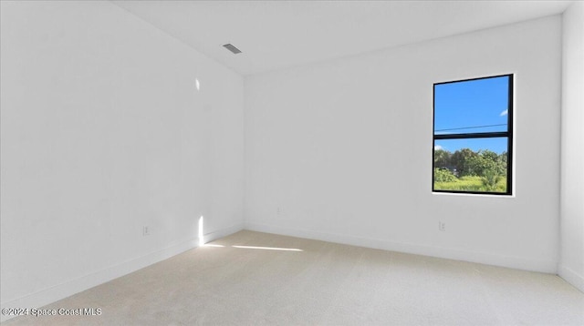 566 Hamy St, Palm Bay, FL 32908 - unfurnished room with light carpet and baseboards