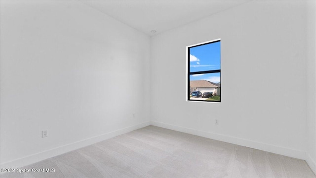 566 Hamy St, Palm Bay, FL 32908 - empty room featuring light carpet and baseboards