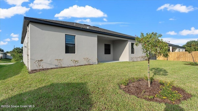 566 Hamy St, Palm Bay, FL 32908 - back of property featuring stucco siding