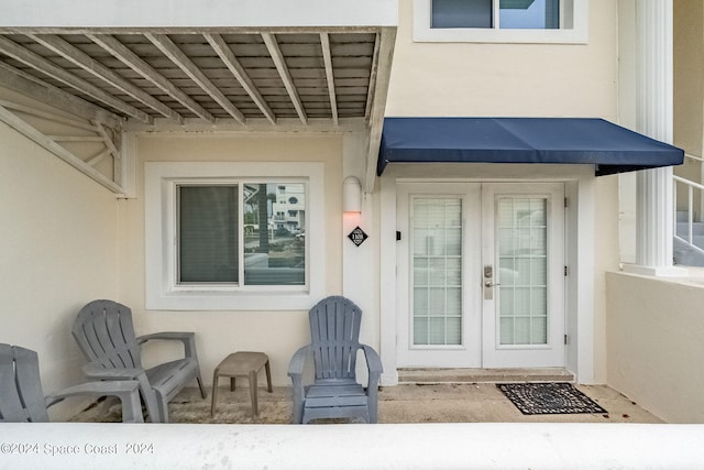 entrance to property featuring french doors