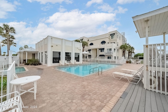 view of pool featuring a patio