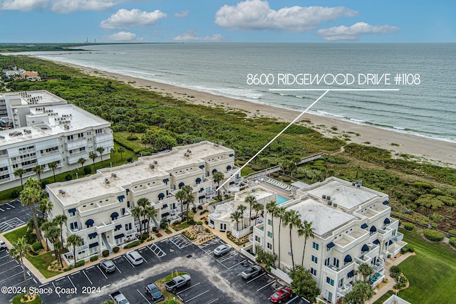 aerial view with a view of the beach and a water view