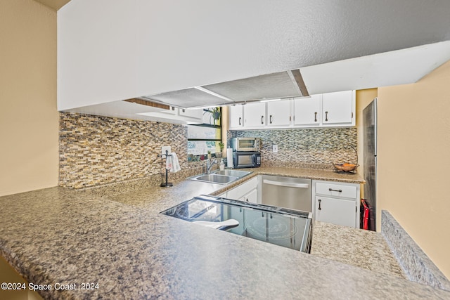 kitchen featuring white cabinetry, dishwasher, black range, and sink