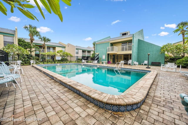 view of pool featuring a patio