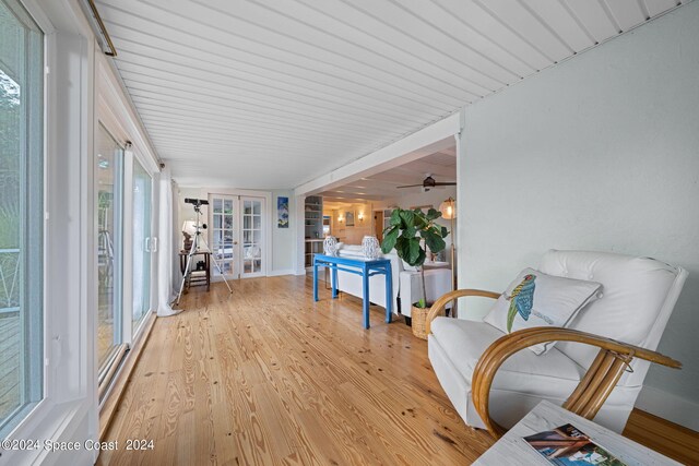 interior space featuring ceiling fan and french doors