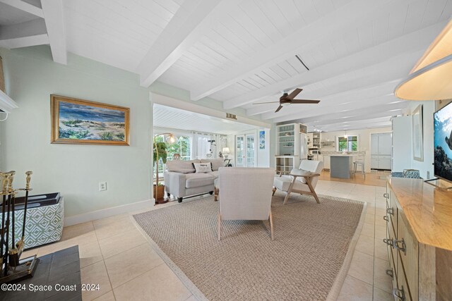 tiled living room with wood ceiling, beam ceiling, and ceiling fan