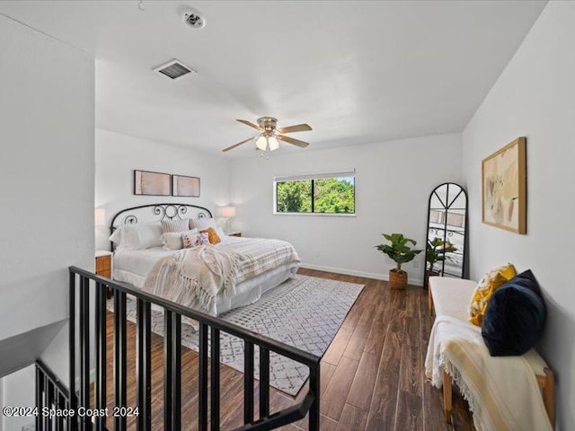 bedroom featuring dark hardwood / wood-style flooring and ceiling fan